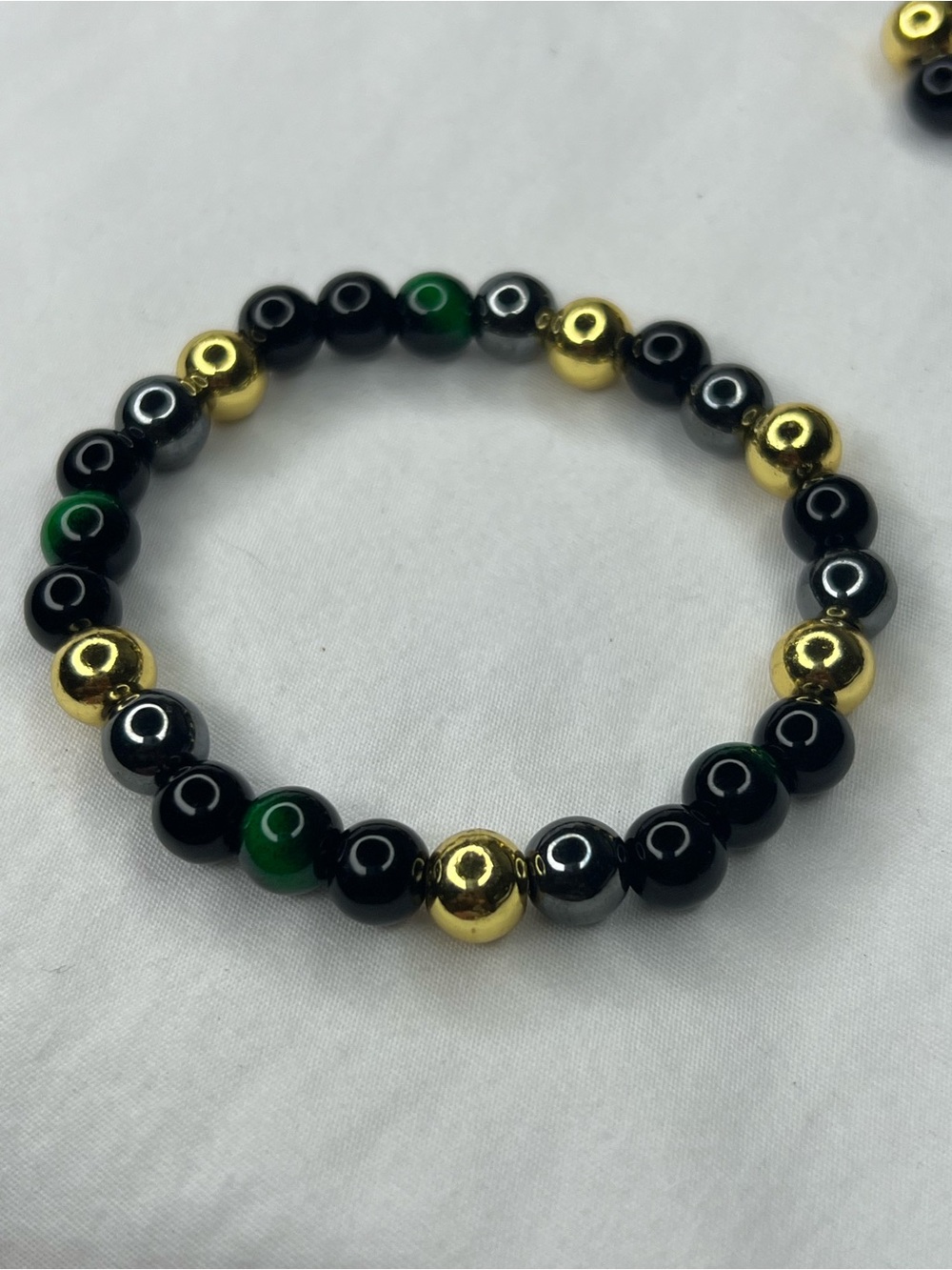 Gold & Black Beaded Stretch Bracelet with Green Tiger eye Accents